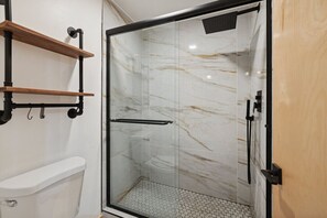 Shower, hair dryer, towels, toilet paper