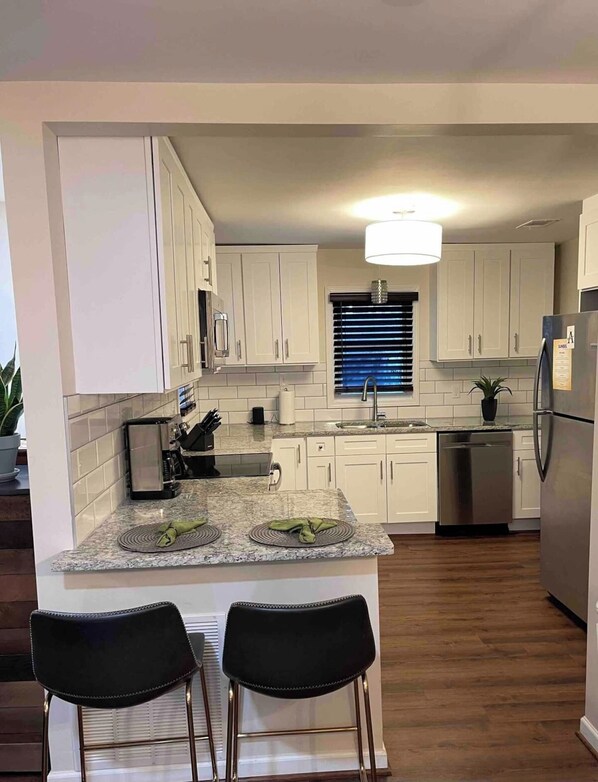 Fridge, coffee/tea maker, cookware/dishes/utensils