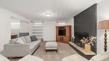 Smart TV, fireplace, foosball, books