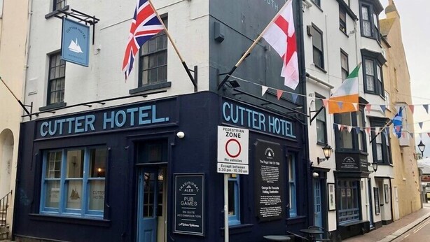 The Cutter Hotel with a sign indicating a pedestrian zone and a pub named "GAMES" below. - Cutter Hotel (Weymouth)