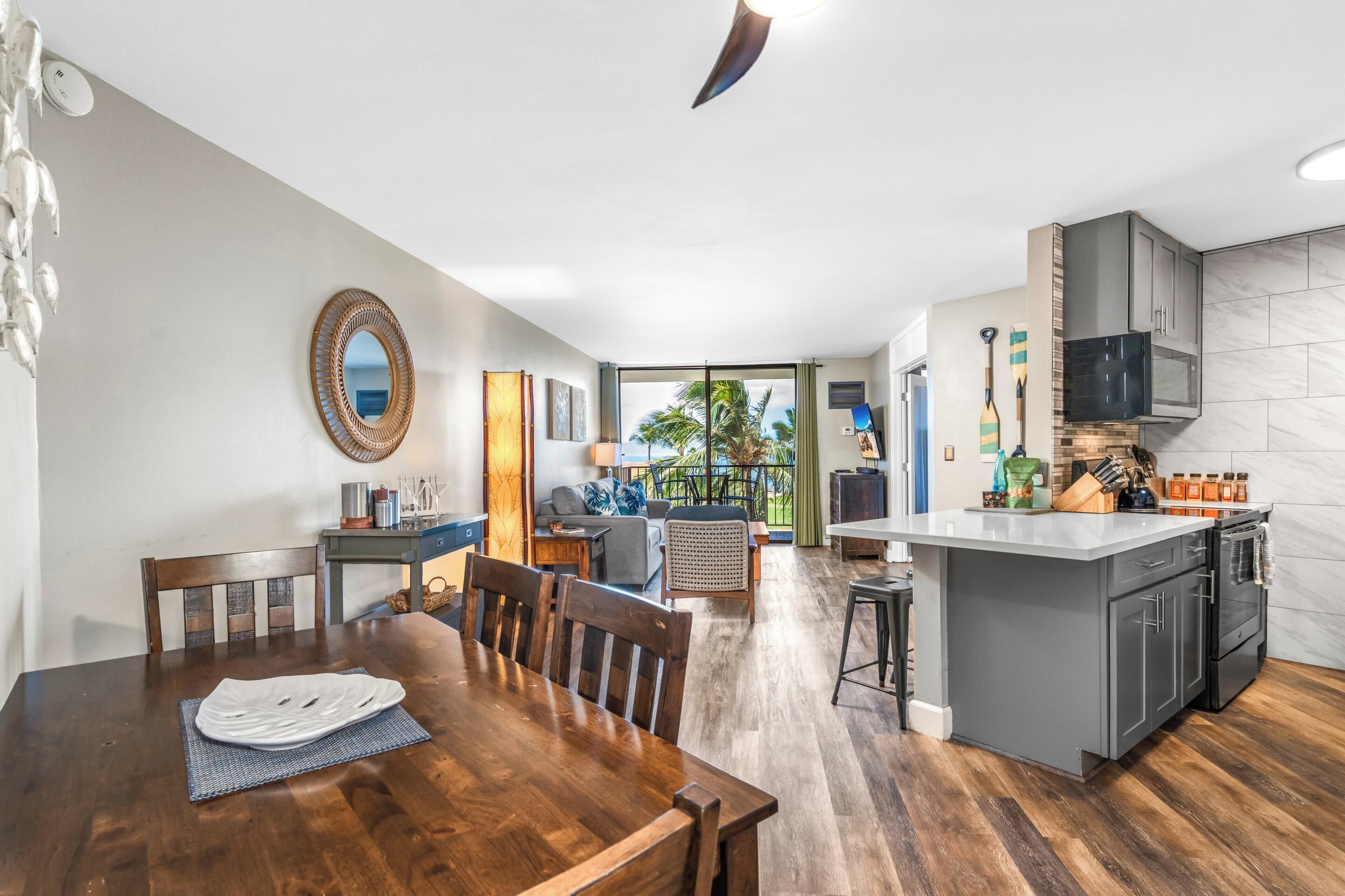 Deluxe Condo | Living area | 55-inch Smart TV with cable channels, TV, Netflix