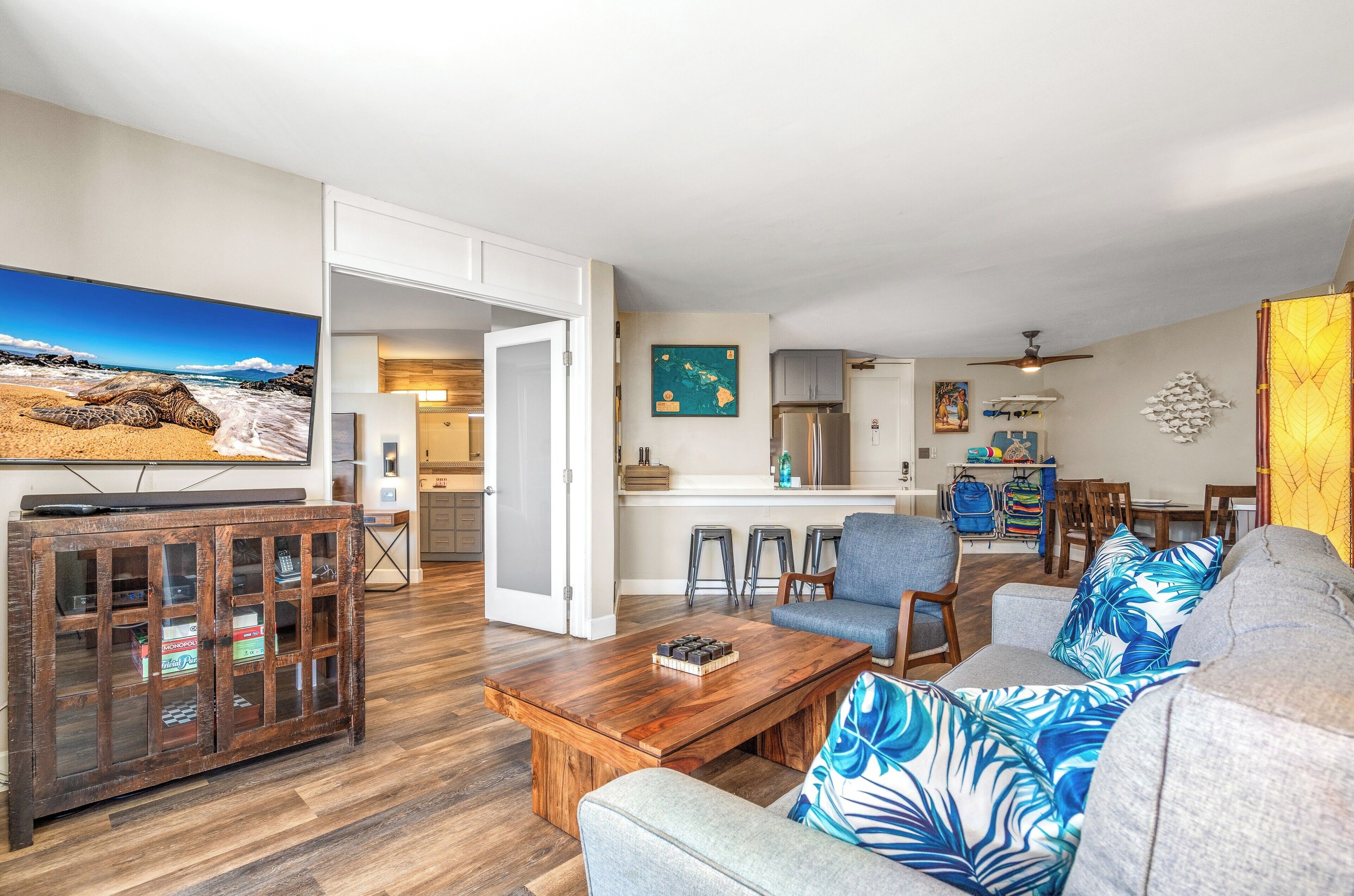 Deluxe Condo | Living area | 55-inch Smart TV with cable channels, TV, Netflix