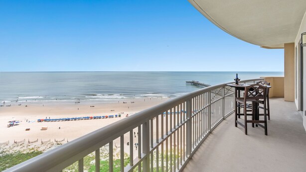 A balcony with a view of the beach and ocean. - $150 activities - E-gift card when you book - Oceanfront | Wrap-Around Balcony | M902 (Myrtle Beach)