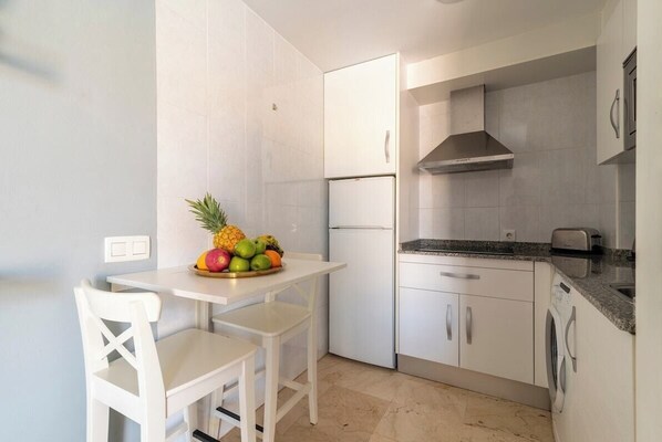Fridge, microwave, stovetop, coffee/tea maker