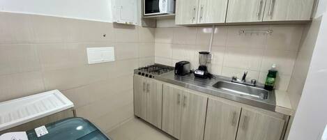 Fridge, toaster, cookware/dishes/utensils