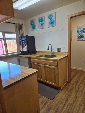 Fridge, microwave, stovetop, coffee/tea maker