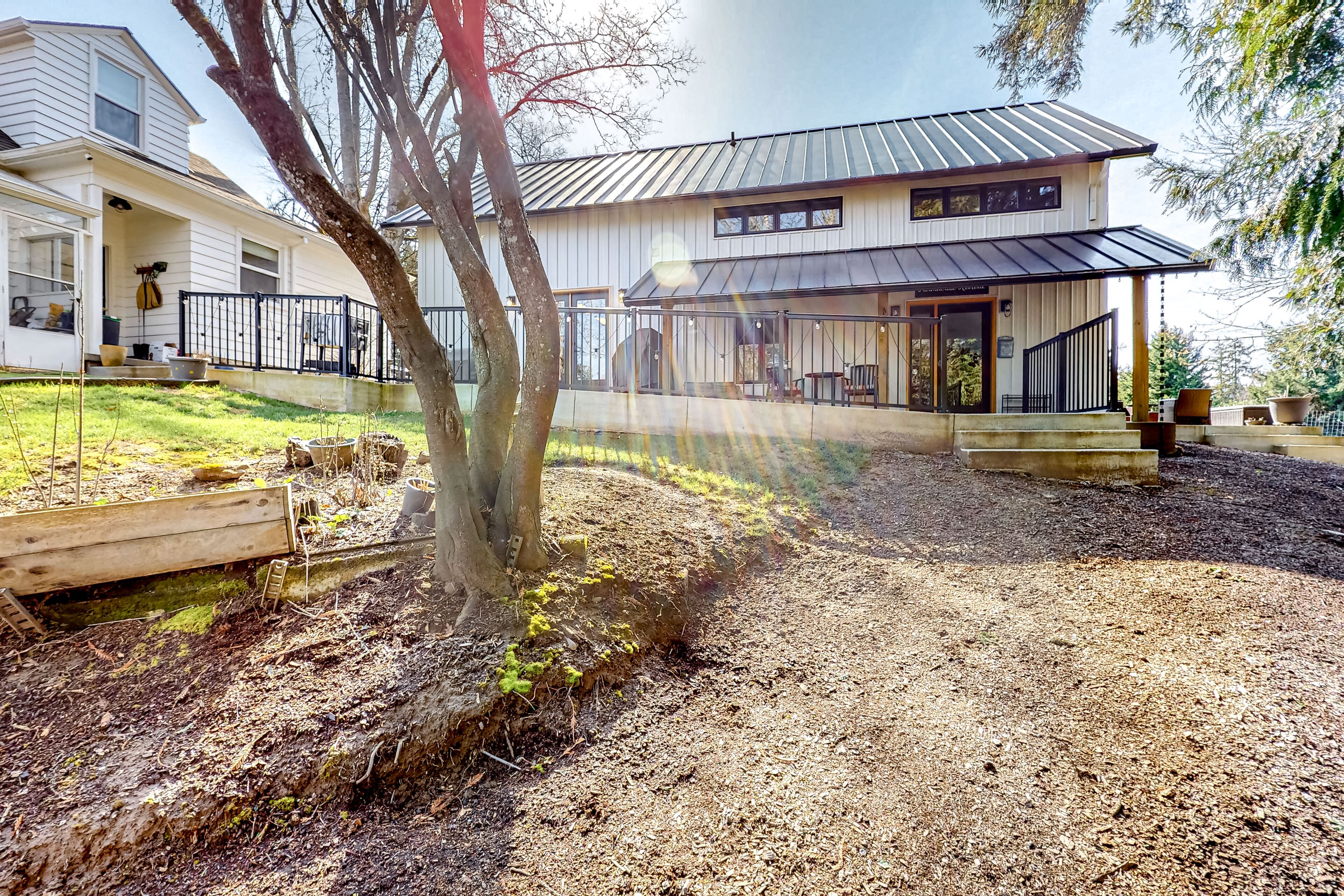 Modern creekside cottage with patios, yard & great location for exploring
