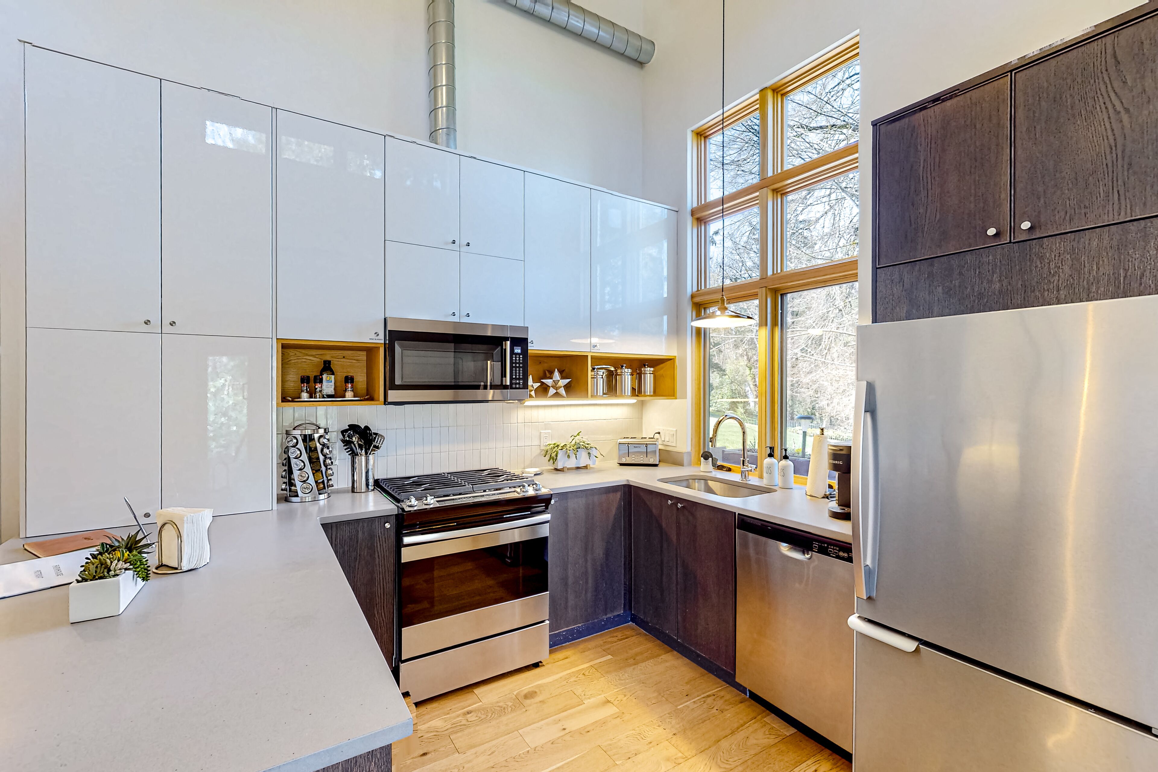 Modern creekside cottage with patios, yard & great location for exploring