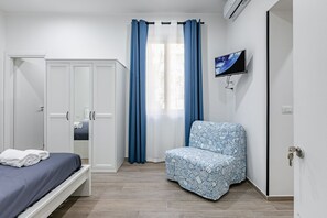 1 habitación, tabla de planchar con plancha, wifi y ropa de cama 