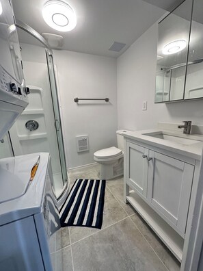 Shower, hair dryer, towels, soap