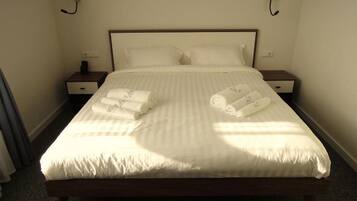 Hypo-allergenic bedding, down comforters, minibar, in-room safe