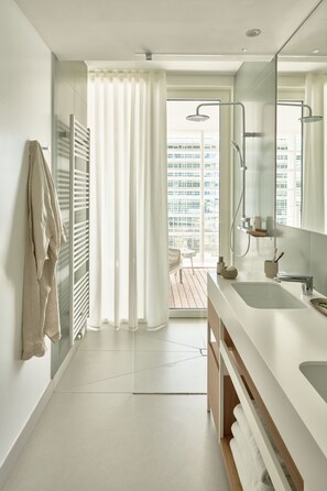 Deluxe Apartment, 2 Bedrooms, Terrace, Partial Sea View | Bathroom | Shower, rainfall showerhead, hair dryer, towels - Falkensteiner Residences Jesolo (Jesolo)