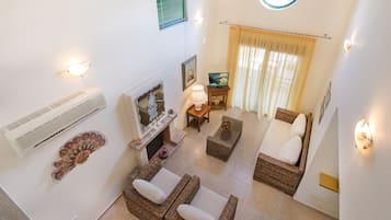 Family Villa | Living area | Fireplace