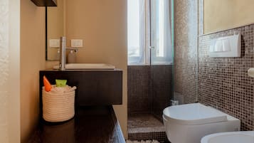 Bidet, towels, toilet paper
