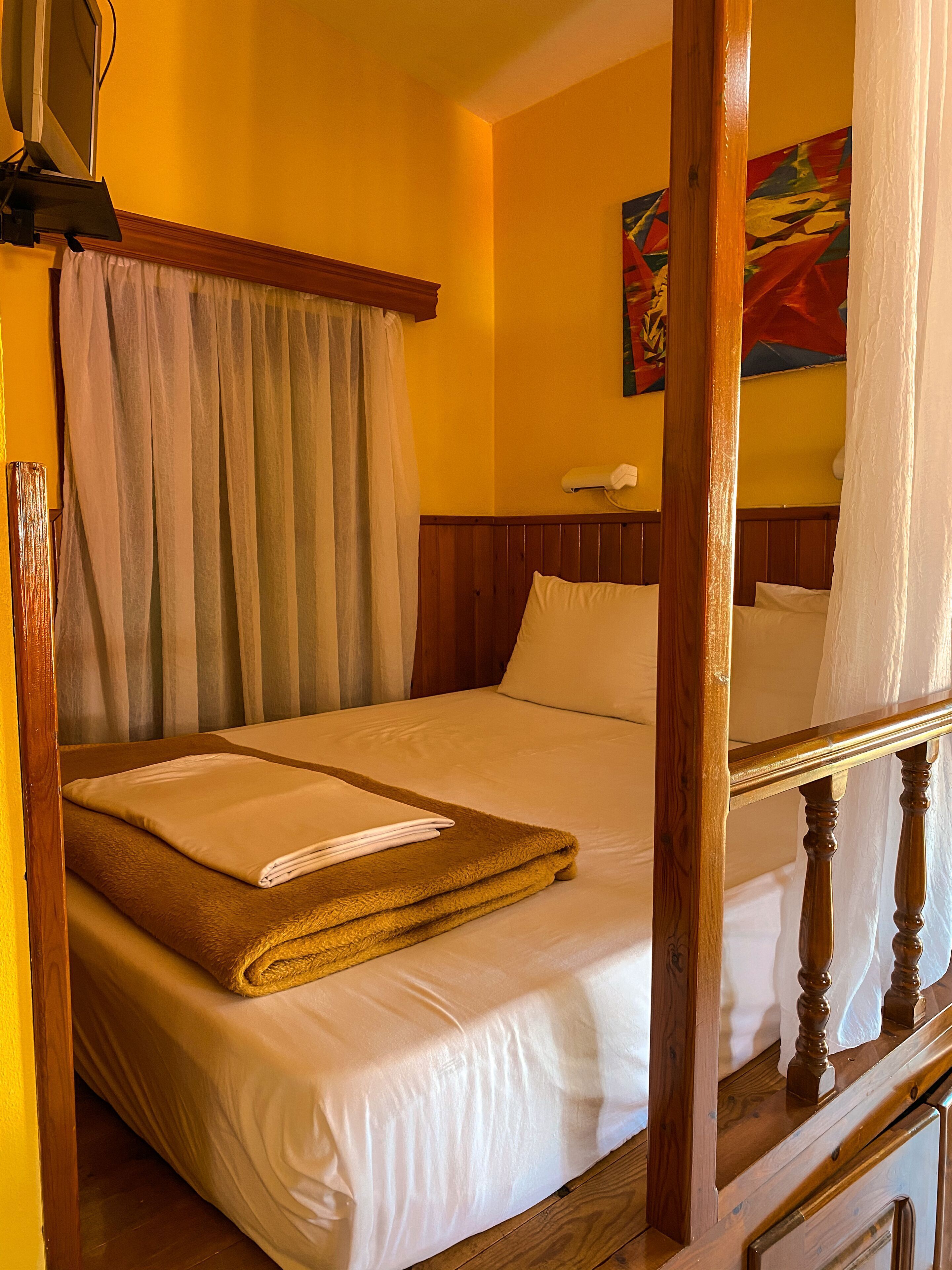 Desk, laptop workspace, free WiFi, bed sheets