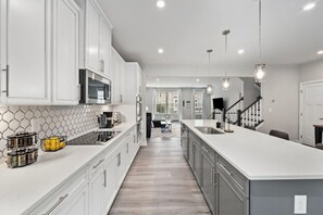 Fridge, microwave, oven, stovetop - Family Fun House at Barefoot Resort (North Myrtle Beach)