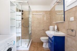Shower, bidet, towels, soap