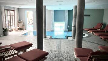 Indoor pool, open 7:00 AM to 9:00 PM, pool loungers