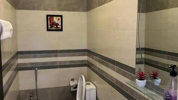 Separate bathtub and shower, designer toiletries, slippers, towels