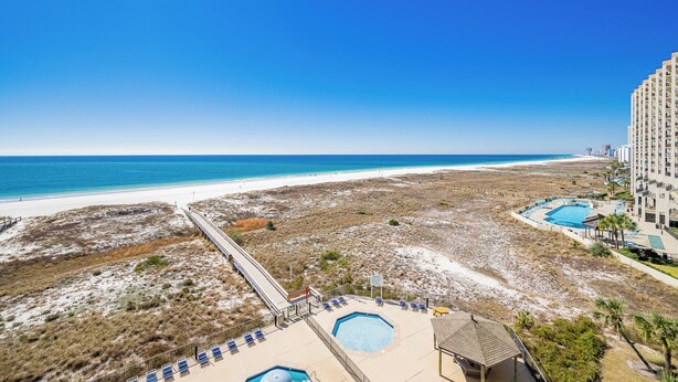 A beachfront hotel with a pool, beach access, and a view of the ocean. - Phoenix 8 Beachfront Condo! (Orange Beach)