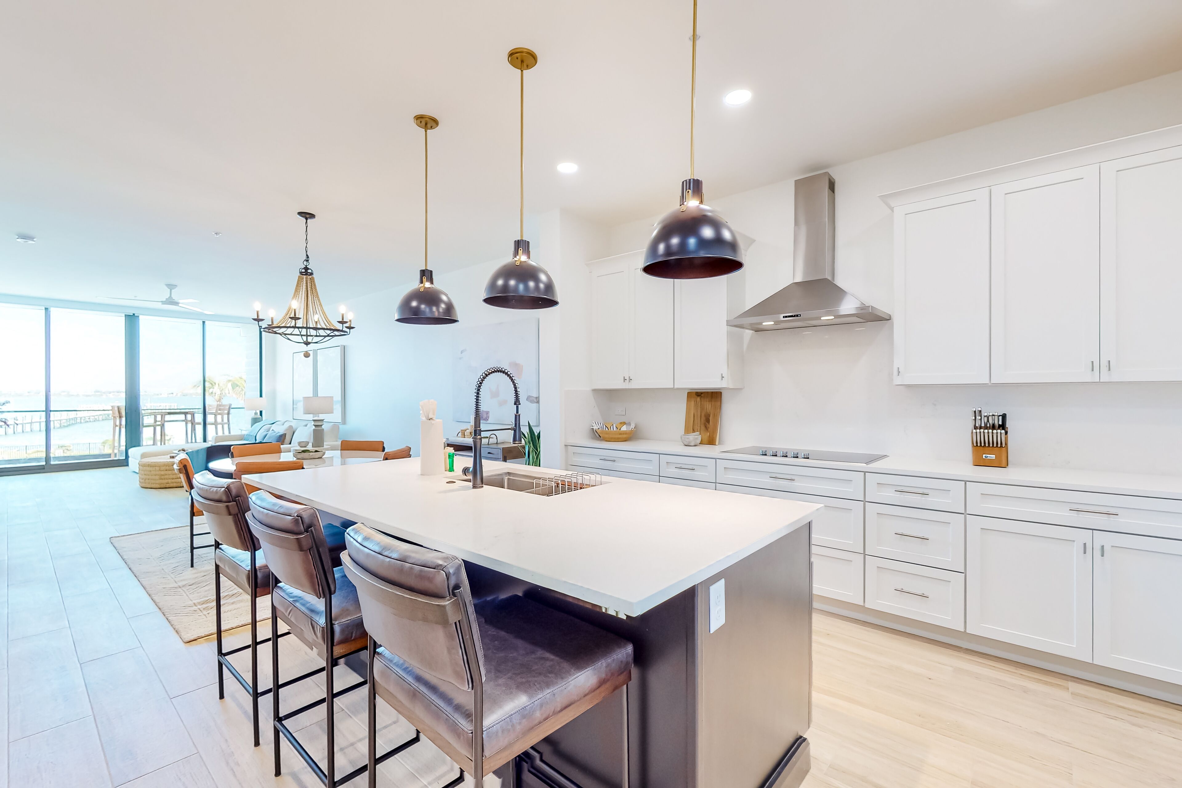 Inviting waterfront apartment with pool, beach access, hot tub, & W/D