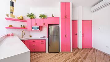 Fridge, microwave, stovetop, coffee/tea maker