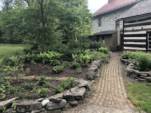 Pathway from the parking area to the back entry .