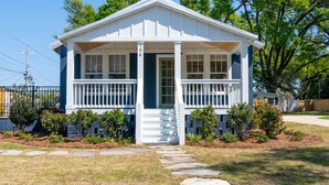 A single-story house with a front porch, a mailbox, and a number 106 sign. - Church St Collection - 106 (Fairhope)