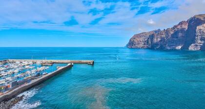 Appartement de vacances "Los Gigantes vue sur mer" prÚs de la plage avec piscine partagée et Wi-Fi