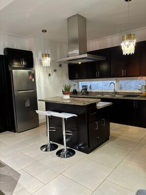 Fridge, microwave, oven, stovetop - Beautiful condo with pool view and private patio. Premier location near beach (Punta Cana)