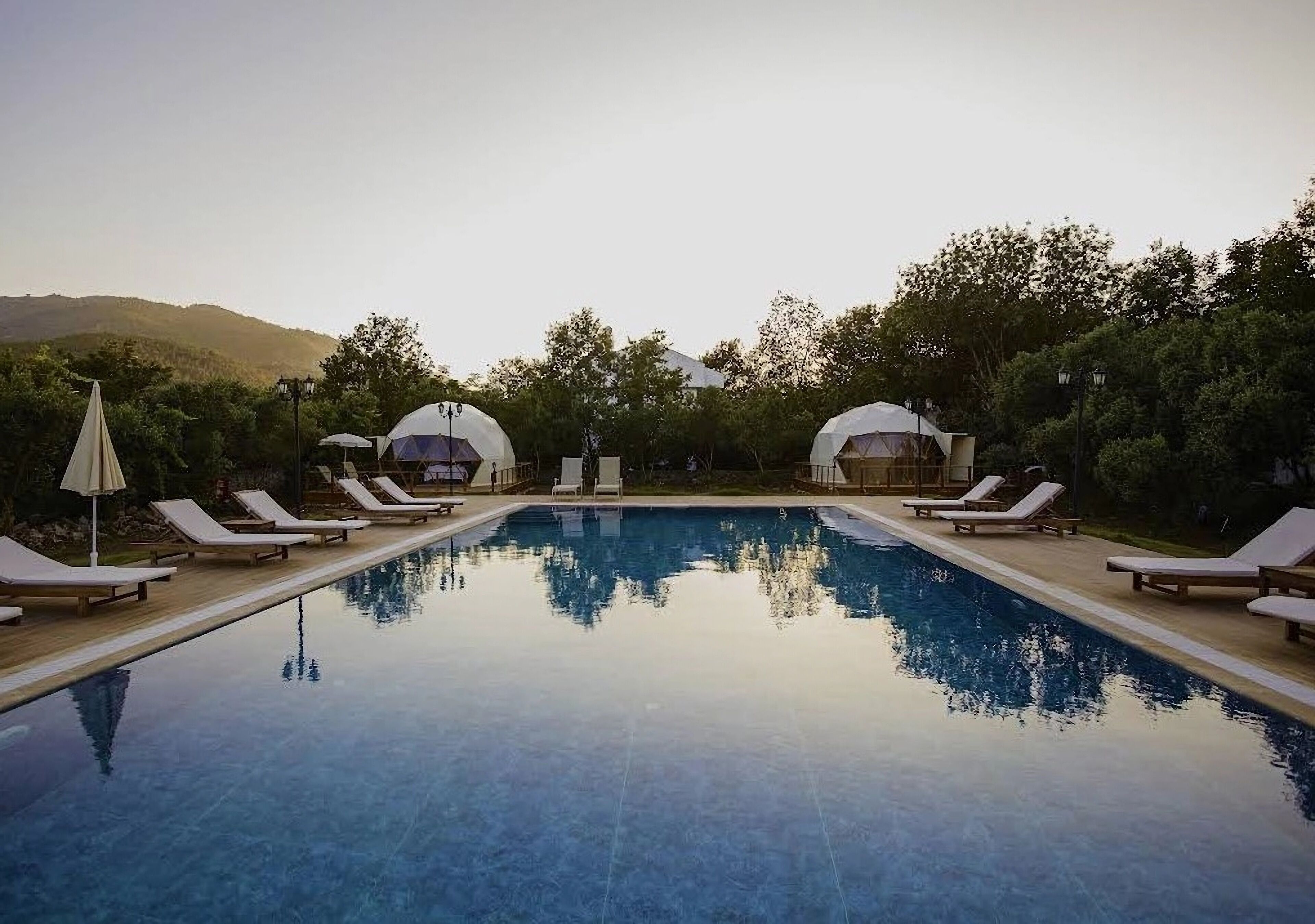 Seasonal outdoor pool, pool umbrellas