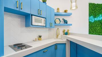 Fridge, microwave, stovetop, coffee/tea maker