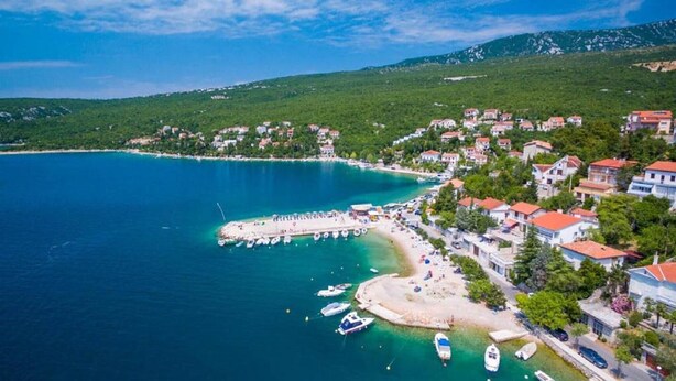 An aerial view of a coastal town with a beach, boats, and houses. - Holiday Home Butkovic - Three Bedroom Holiday Home (Sunger)