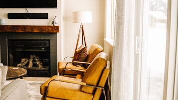 Smart TV, fireplace, books