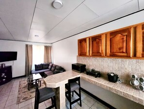 Basic Townhome, 2 Bedrooms, Accessible | Living area | 48-inch flat-screen TV with cable channels, TV, Netflix