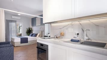 Luxury Studio, 1 Bedroom, Non Smoking, Sea View | 1 bedroom, down comforters, memory foam beds, in-room safe