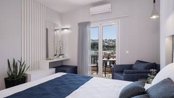 Estudio de lujo, para no fumadores, vista al mar | Edredón, camas con efecto memoria y caja de seguridad en la habitación