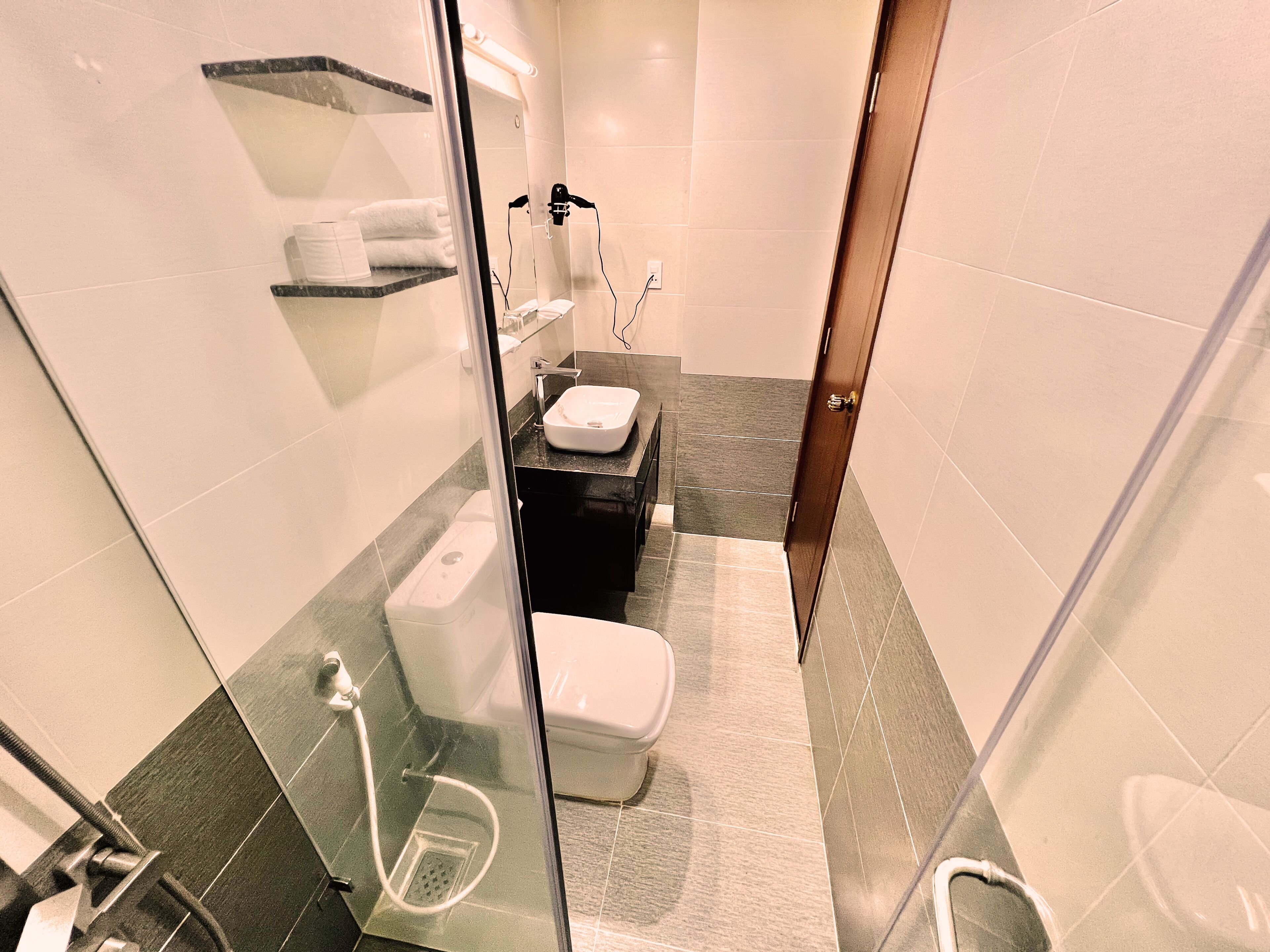 shower, hair dryer, slippers, bidet