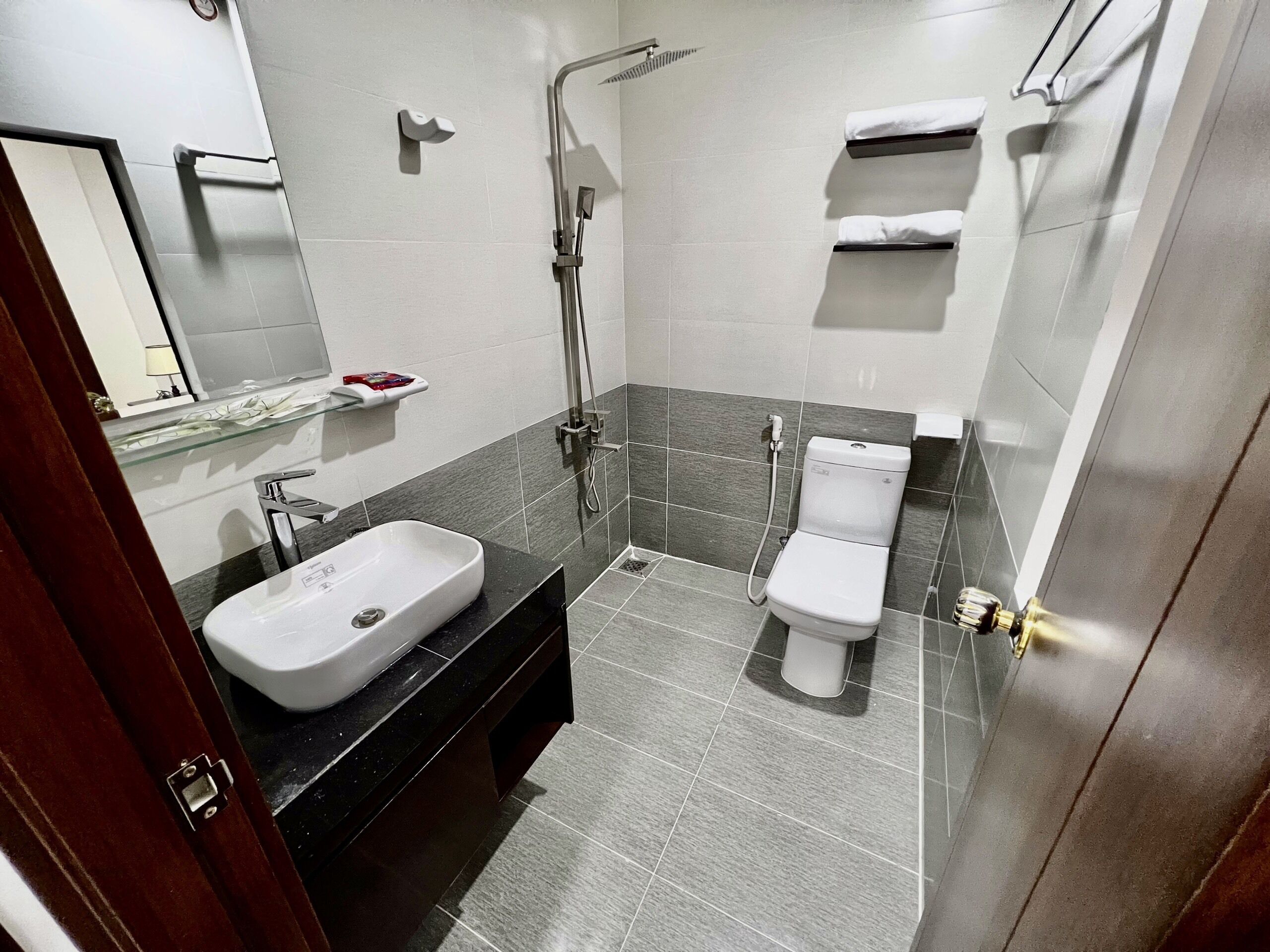 shower, hair dryer, slippers, bidet