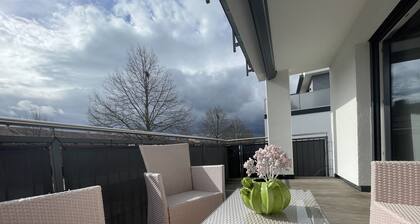 Modern and centrally located holiday apartment with a large balcony.