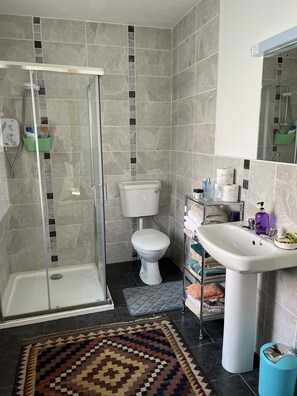 Shower, hair dryer, towels, soap