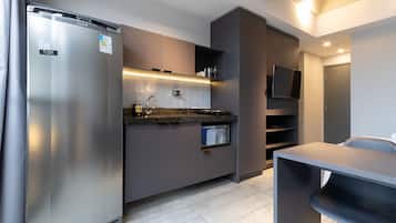 Fridge, microwave, stovetop, coffee/tea maker