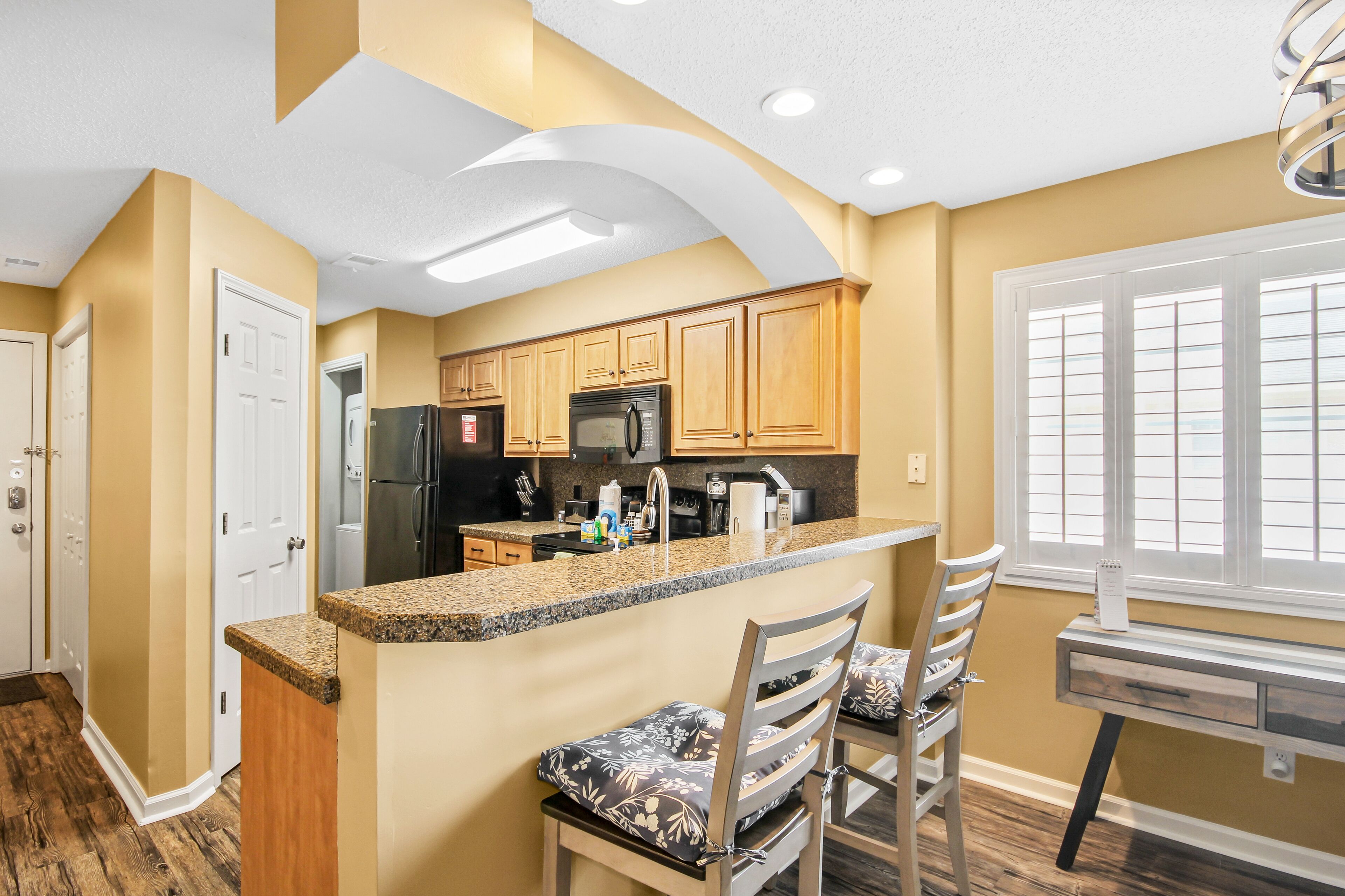 Sunny retreat near the beach with modern updates & AC - hot tub and pool access