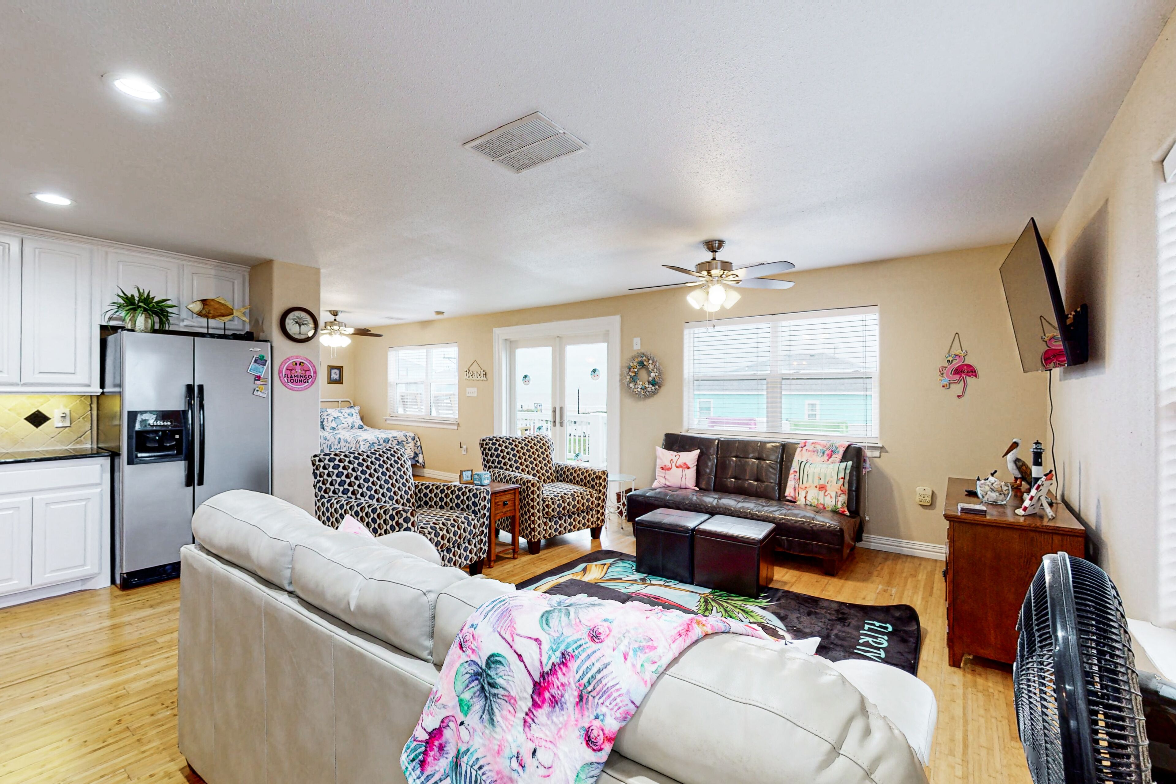 Colorful beachfront stay with scenic balconies, gas grill, W/D, & AC - dogs ok