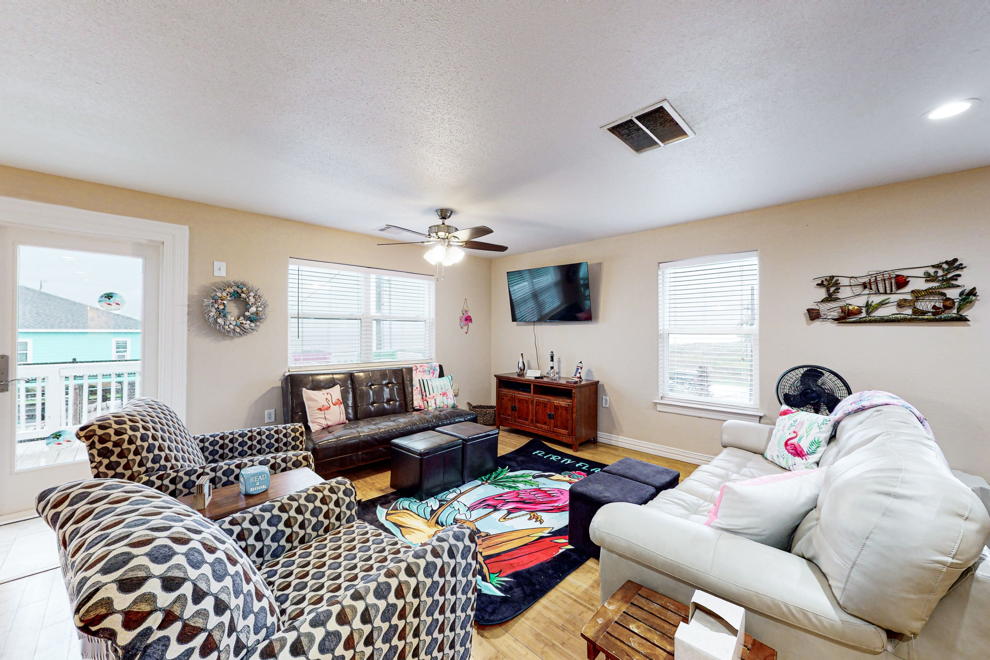 Colorful beachfront stay with scenic balconies, gas grill, W/D, & AC - dogs ok