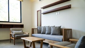 Family Apartment | Living area | 32-inch flat-screen TV with cable channels, TV