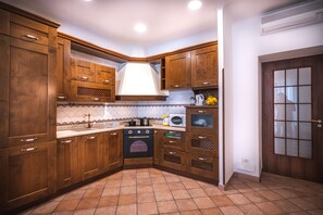 Fridge, microwave, stovetop, coffee/tea maker