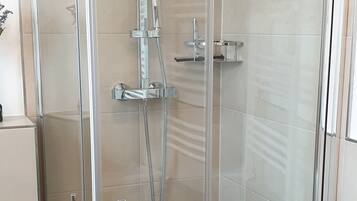 Shower, hair dryer, towels, soap