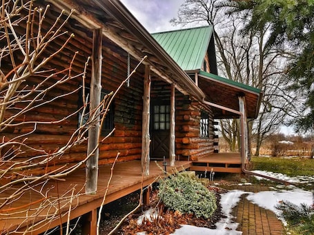 Exterior. Authentic log cabin!