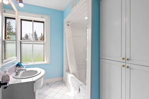Traditional Cottage | Bathroom | Hair dryer, towels, soap, shampoo